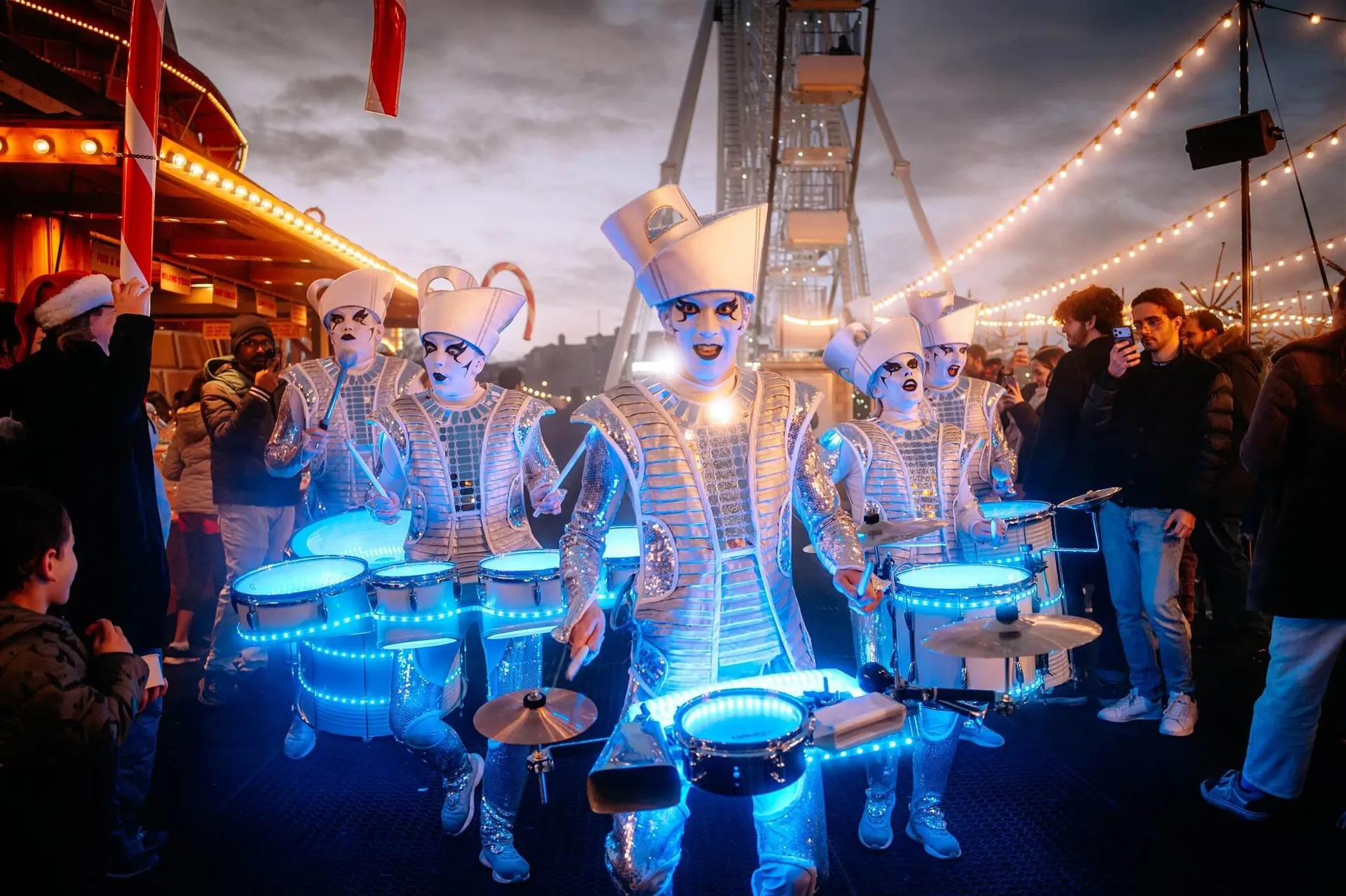 LED drummers performing at night