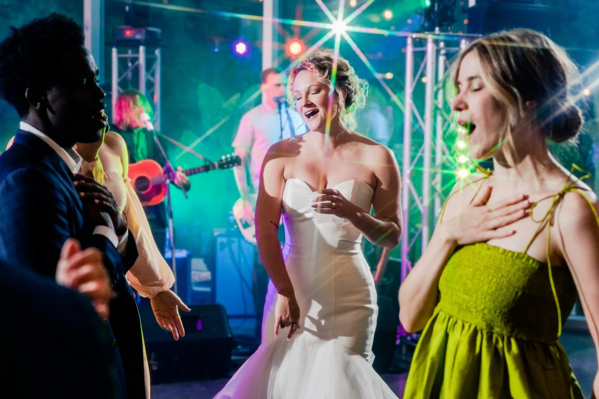 Bride and guests dancing to a live band